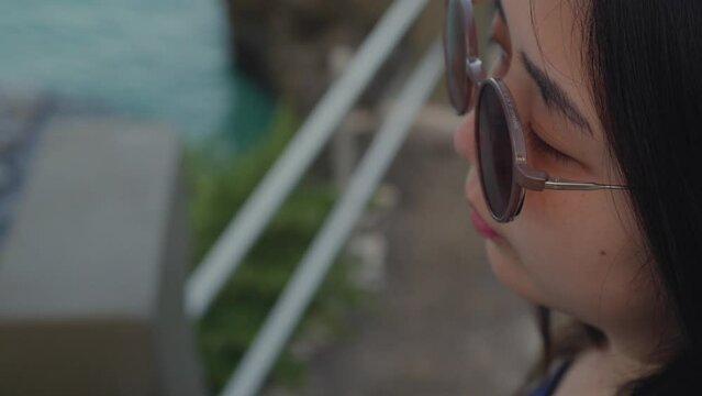 Close up shot of a girl exploring Taga beach