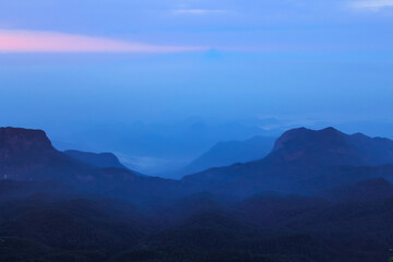 The sunrise sky and the morning mist at the Adam's Peak, Sri Lanka