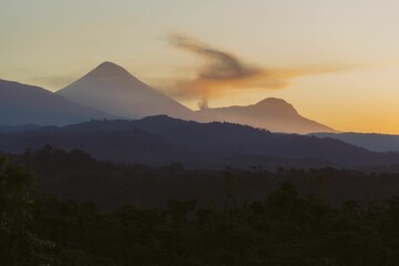 Magnificent sunset illuminating the sky over the Santa Maria volcano in Guatemala.