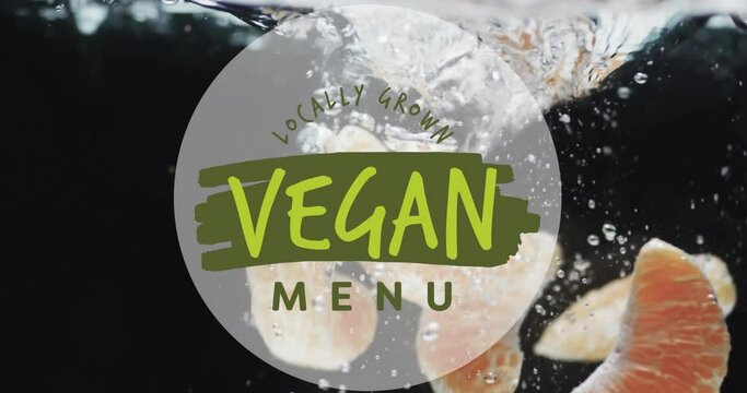 Animation of vegan menu text over fruit falling in water background