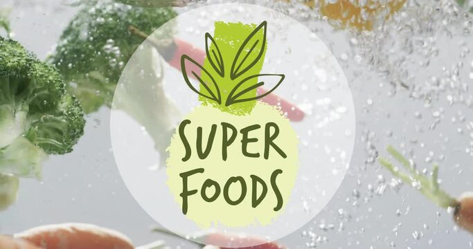 Animation of super foods text over fruit falling in water background