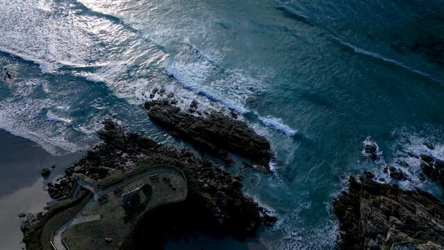 Sea Waves Splashing On Rocky Coastal