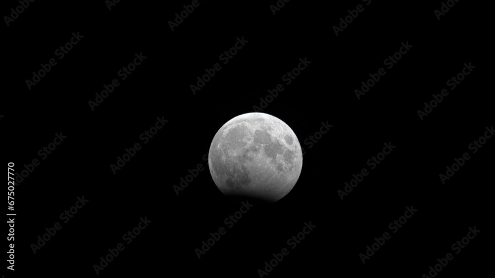 Wall mural time lapse of partial moon eclipse at october 2023