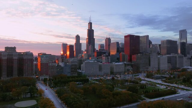Chicago skyline with Sears tower at sunset from Millennium Park aerial