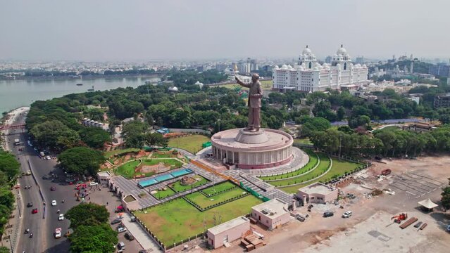Ambedkar statue with telangana secretariate in the background at tankbud, hyderabad, telangana pull away drone shot4k