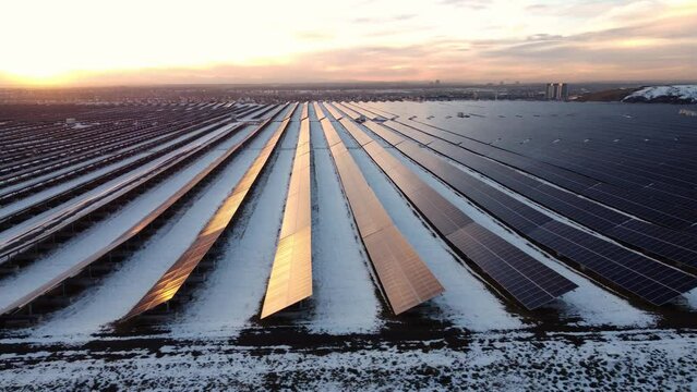 A large-scale solar panels power plant in snowy Canadian winter.