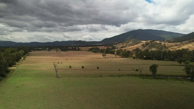 Over paddocks towards the mountains surrounding Eildon, Victoria, Australia