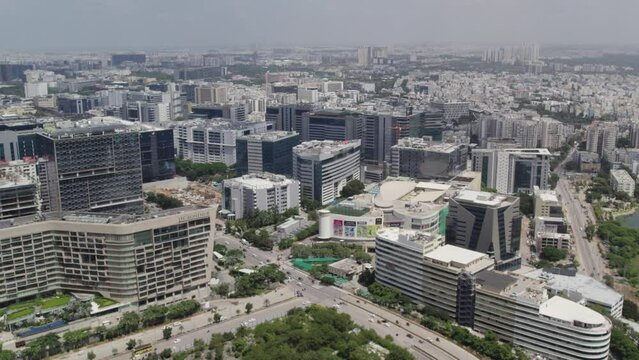 Aerial footage On a Sunday morning, the roads of the developing smart city have less traffic. Surrounding roads are empty of corporate offices and skyscrapers. Silicon Valley's growing stage