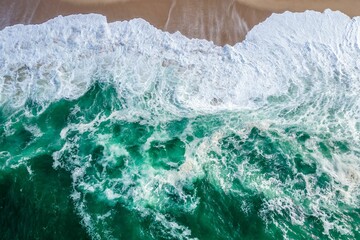 Aqua wave on sand beach