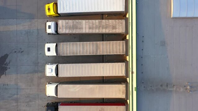 Aerial view of distribution center, drone photo of industrial logistics zone,new super modern logistics center full of modern technology and robotics,roof solar power plant for green energy production