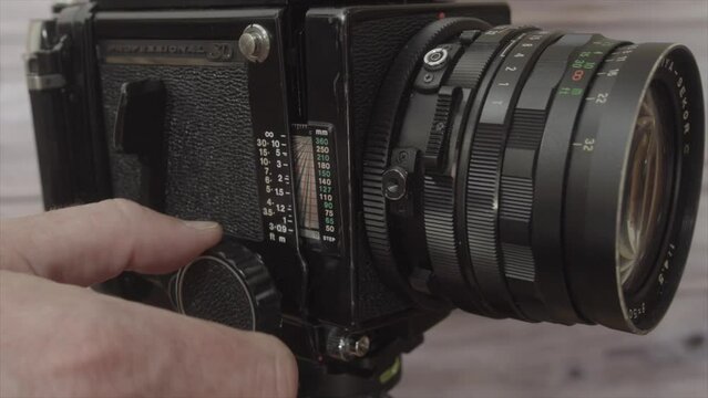 operating a vintage analogue 120 medium format film camera