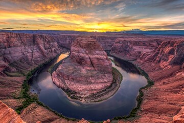 Breathtaking view of the warm Arizona sunset at the majestic Horseshoe Bend. © Wirestock
