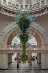 Metre high, View of Blown glass chandelier in Victoria and Albert Museum hall. Beautiful interior...