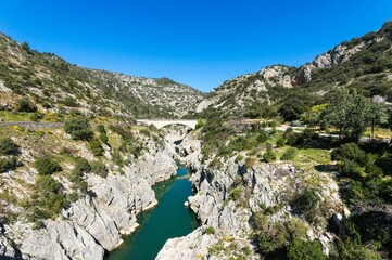Aerial view of the Devil's Bridge over a narrow gorge of the Herault river in South France