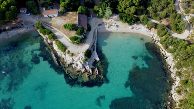 Drone footage of the Spiaggia dei Baracconi Beach in Golfo Aranci City in Sardinia, Italy