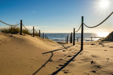 Beautiful Delaware beach scene at sunset, featuring a wooden fence along the shoreline - obrazy, fototapety, plakaty