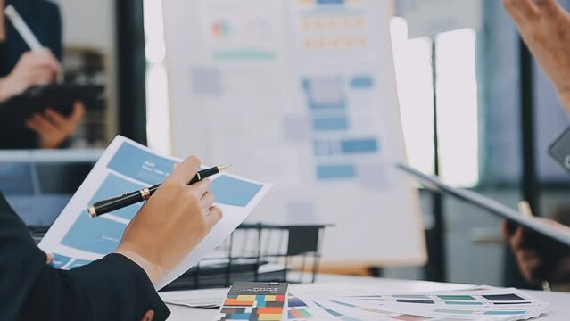 Team of Creative Web Graphic Designer planning, drawing website ux app for mobile phone application and development template layout, process to developing prototype wireframe, User experience concept.