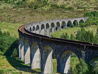 iconic Glenfinnan viaduct of the jacobite steam train. - obrazy, fototapety, plakaty