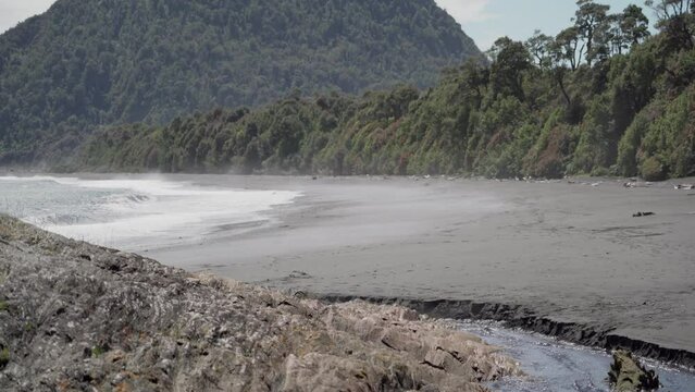 grey volcanic beach close to Chaiten in Patagonia