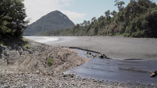 Scenic view of grey volcanic beach close to Chaiten in Patagonia, Chile