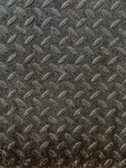 Macro shot of the rusted metal diamond tread plate texture