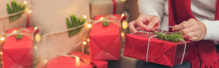 Banner Woman surprise got present gift box on christmas eve. Asian woman holding christmas gift box...