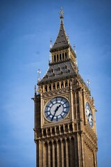 Fototapeta na wymiar Vertical of Big Ben against the blue sky in London, England, UK