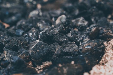 Closeup shot of a pile of dark coal pieces