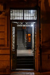 Open door reveals a dark and mysterious hallway in Vere, Mtatsminda District, Tbilisi, Georgia