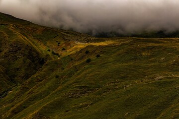 Stunning mountain range with rolling hills and lush green grass carpeting the landscape, Georgia