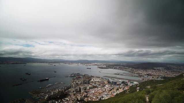 Storm clouds flowing over Gibraltar, aerial view