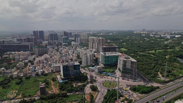 Financial District Circle with vehicles and traffic jam and nehru outer ring road aerial view top down drone shot at Nanakramguda, hyderabad, telangana.