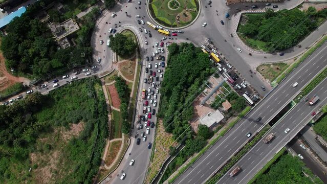 Financial District Circle with vehicles and traffic jam and nehru outer ring road aerial view top down drone shot at Nanakramguda, hyderabad, telangana.