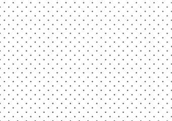 A graphic background made from an orderly arrangement of dots on a white background created from a graphics program used in media design.