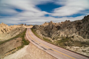 Landscape of a road in the Badlands National Park, South Dakota - obrazy, fototapety, plakaty