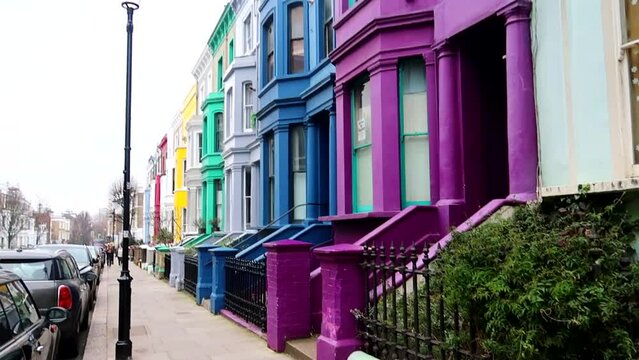 Lancaster Road houses with vibrant colors in Notting Hill district close to Portobello Road in London, UK