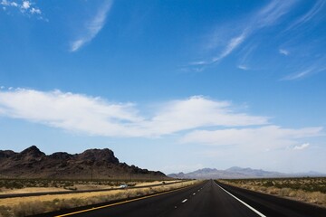Image showcases a desolate stretch of Route 66, the iconic American highway, located in Nevada, USA