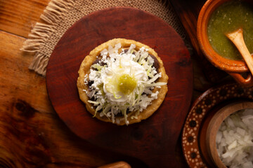 Sope. Traditional homemade Mexican food prepared with flattened and pinched on the border fried...