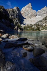Delta Lake at Grand Teton National Park, Wyoming in the foreground of a mountain range