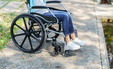 Obraz premium Depressed sad asian woman in wheelchair&nbsp;lonely disabled adult