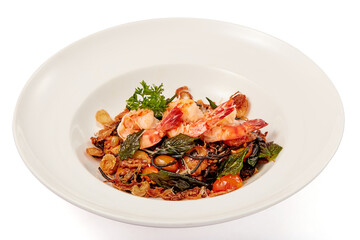 Black pasta stir fried arrabbiata sauce with Tiger prawn served in white plate isolated on white background.