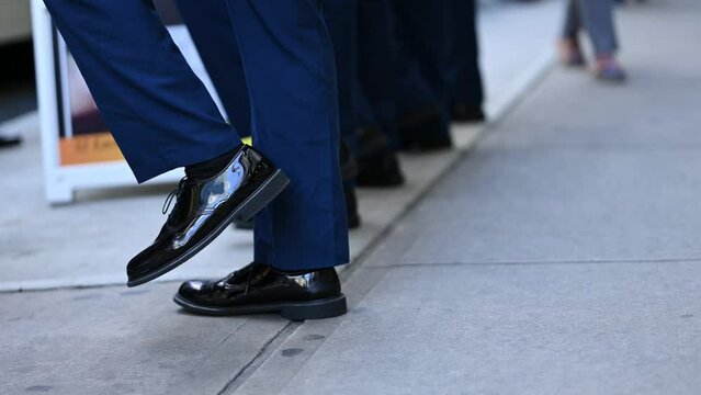 a gropu of police marching on the street