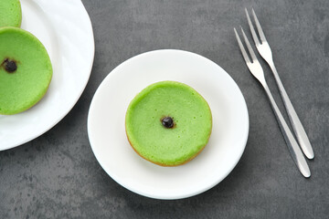 Kue Lumpur Pandan or Mud Cake, Indonesian traditional snack made from potatoes, pandan leaf, flour, eggs and coconut milk
