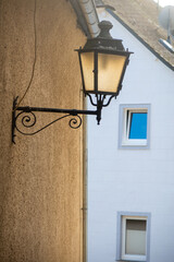 Fototapeta na wymiar Vintage smoke lamp on the exterior wall of homes in Rothenberg, Germany