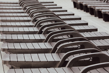 Sun loungers on the beach as an abstract background