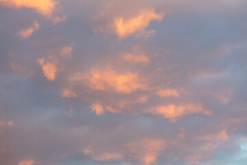 Naklejka na ściany i meble Colorful clouds on the blue sky at sunset