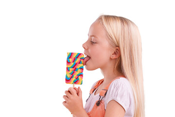 Isolated girl child, lollipop and lick in profile for eating, sweets or thinking by transparent png background. Kid, candy and dessert with rainbow color, snack and idea with fashion, taste or tongue - obrazy, fototapety, plakaty