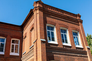 Stained glass window in an old brick house