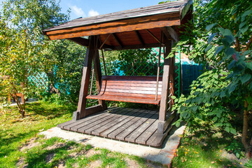 Naklejka premium Bench in a park in nature