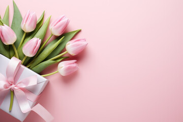 Beautiful bouquet of pink tulips arranged in white gift box. Perfect for expressing love, appreciation, or celebrating special occasion.